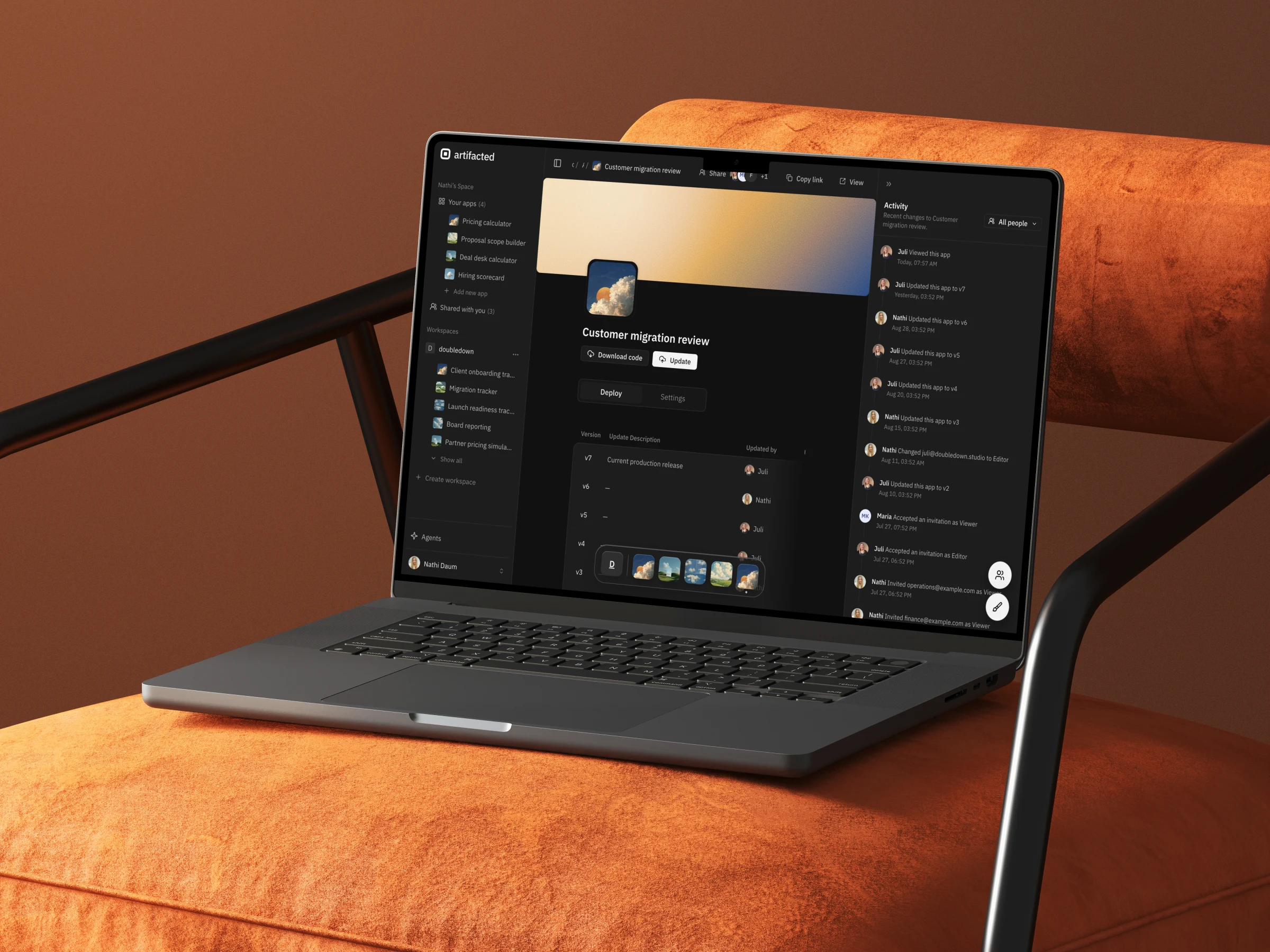 artifacted app detail in dark mode on a laptop in an orange lounge